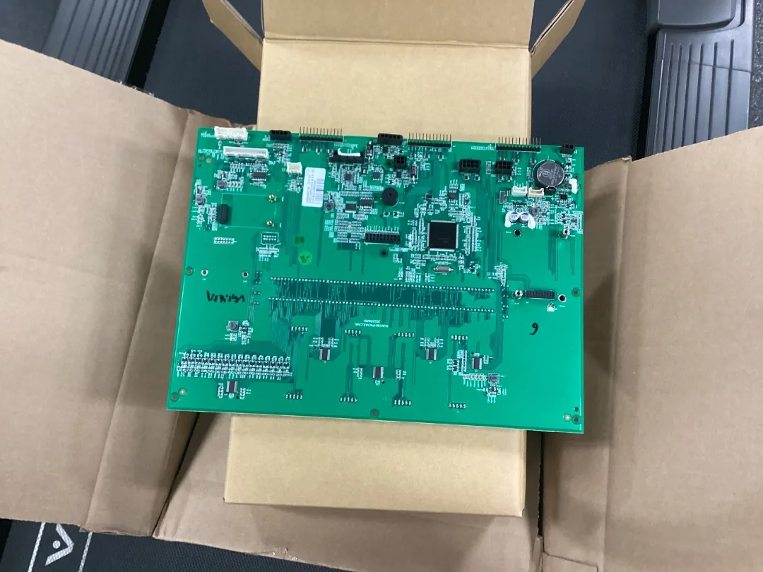 Replacement treadmill control circuit board in its open shipping box