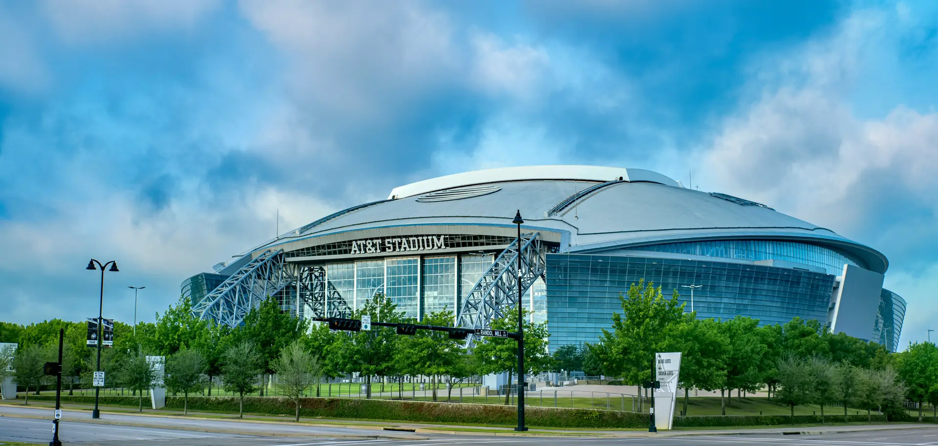 AT&T Stadium in Arlington under a cloudy sky