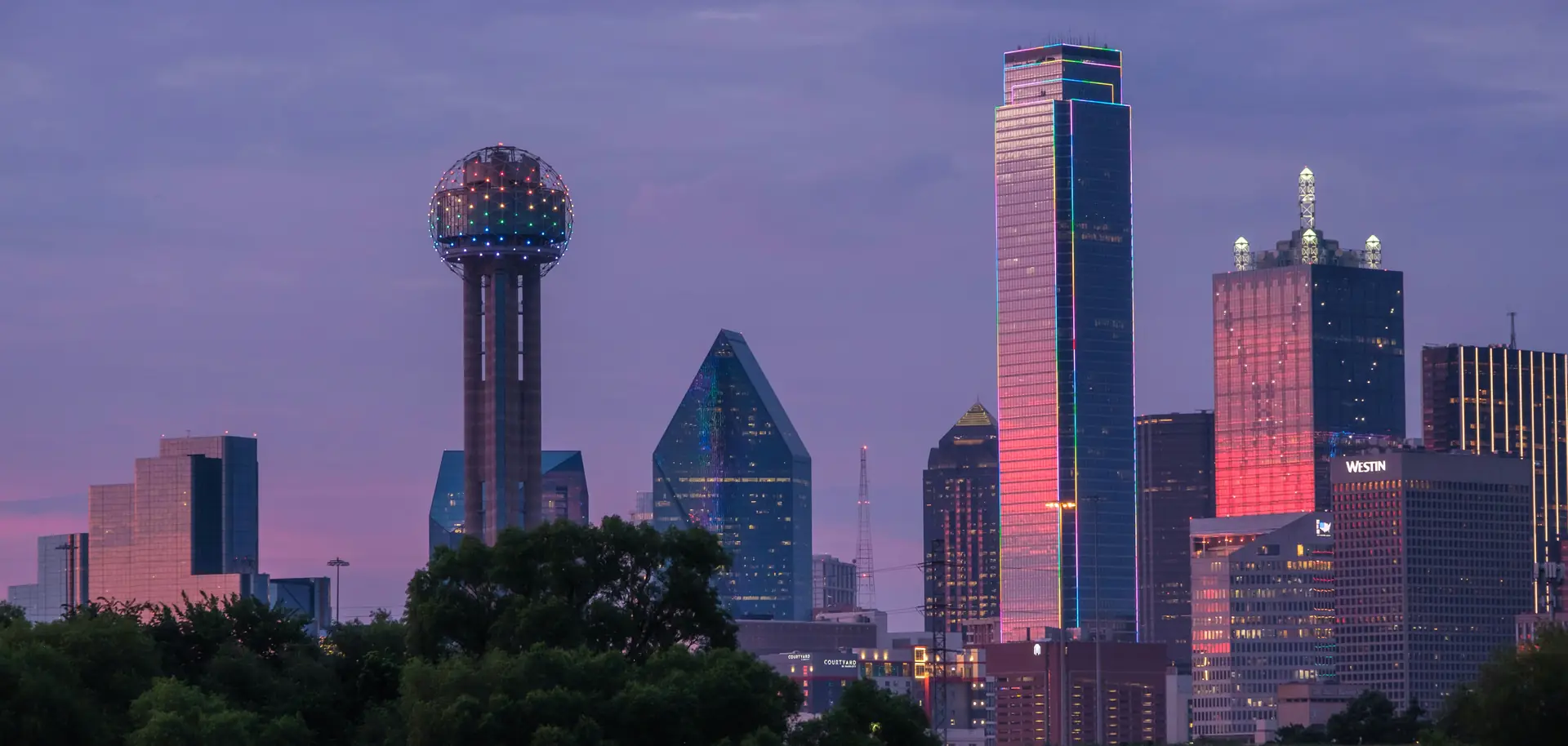 Downtown Dallas skyline at dusk with Reunion Tower, Fountain Place and Bank of America Plaza